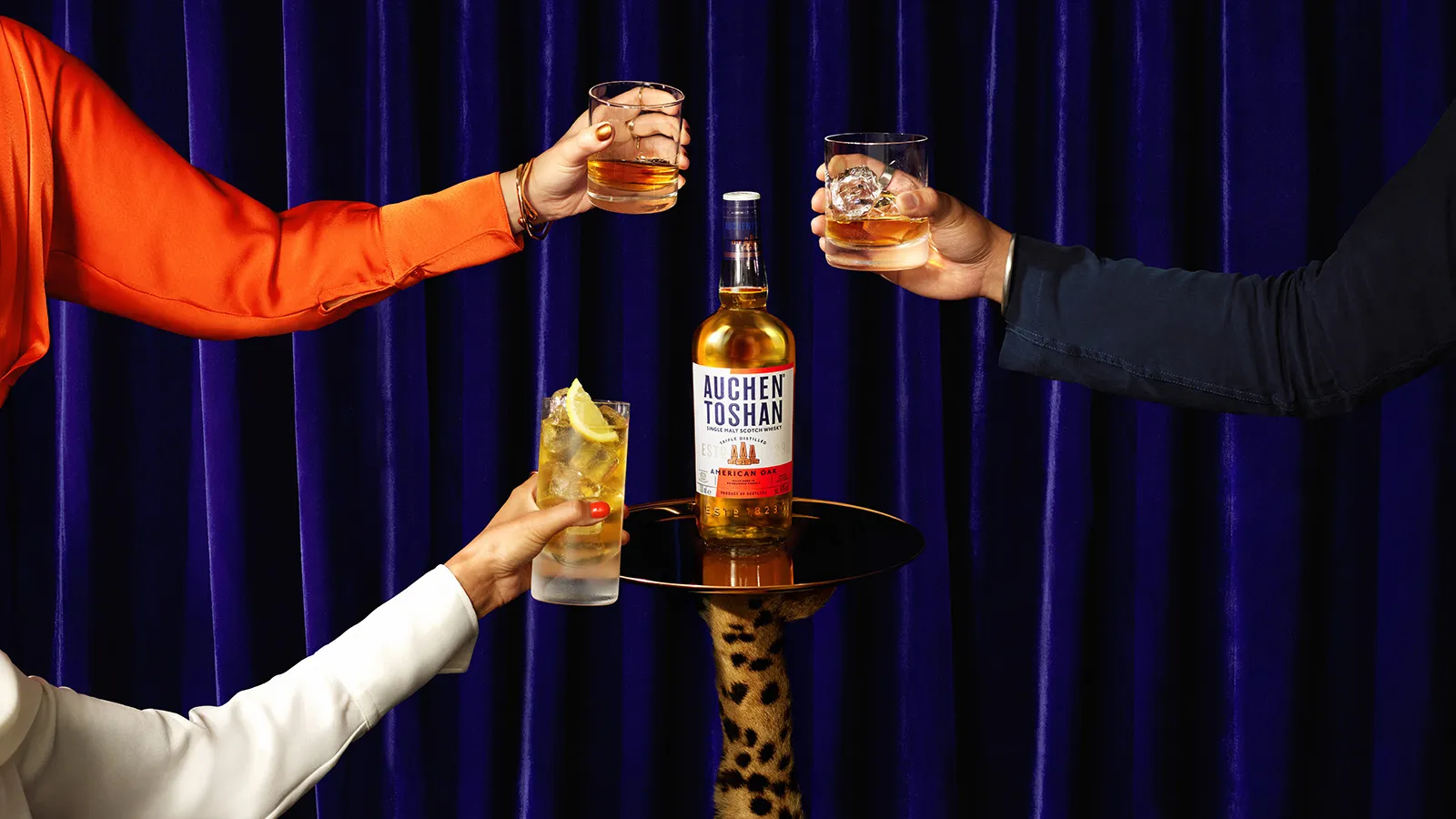 Whiskey glasses toast blue curtain auchentoshan